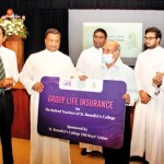 Handing over the memento of Life Insurance Cover by Rev. Bro. Director of St. Benedict’s College (Dr) Pubudu Rajapaksha to President of Past Teachers Association. OBU Gen. Secretary  Mr Priyal Perera & rest of the Rev. Brothers also in the picture