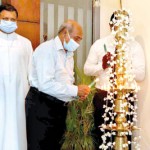 President of Past Teachers Association Mr Hilary Costa lighting the oil lamp