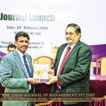 Handing over the Journal  to Mr. Manil Jayesinghe
