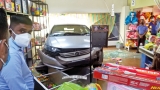 Motorist crashes into supermarket showroom