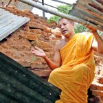 Chief Incumbent Poththukkulame  Dheerananda Thero points out the damage to the structure