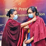 Prof Sagarika Ekanayake presenting the President Medal to Prof Srianthi Deraniyagala