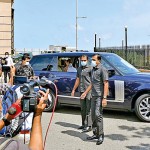 President Gotabaya Rajapaksa drives past  protesters on his way to Presidential Secretariat