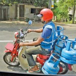Sign of our times: Loaded with empty cylinders  Pic by Indika Handuwala