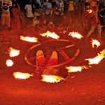 Playing with fire: Artistes perform at the Gangaramaya Nawam Perahera in Colombo