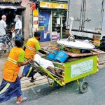 City slick: Workers keeping the city clean . Pix by Eshan Fernando