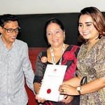 Irushi Tennakoon receiving the Best National Short Film from Prasanna Vithanage and  veteran actress Sriyani Amerasena