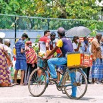 Kotahena: Cool treat: An ice cream vendor finds no takers in the long queue Pic by Akila Jayawardana