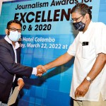 Best Designed Newspaper of the year (2020):   Asitha Ratnayake from the Sunday Times design team receives the certificate of merit from Udaya Kalupathirana, Member of the Free Media Movement