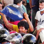 Dambulla- Full tank: A biker's dilemma Pix by Kanchana Kumara Ariyadasa