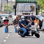Narahenpita - No way: People in a gas queue block a road
