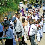 Milton Amarasinghe, President of the Vidudeya J/Pura Friends Organisation, and others, being welcomed as they arrived in a procession at Wewegama Maha Vidyalaya.