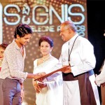 Rev. Fr. Roshan Silva, the Provincial of the Colombo Province of Oblate of Mary Immaculate (OMI) Congregation handing over an award to a winner at the SIGNIS Salutation