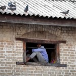 Fort: Pensive perch: A man lost in thought. Pix by Eshan Fernando