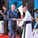 Presenting the first Blue and White  copy to Rev. Fr. Rector By the  Editor in Chief Mr. Lynn Ockersz