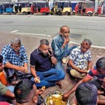 Fort - Meal time: People in a queue share a meal