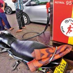 Town Hall Sleeping in line: A bike rider carries a sleeping mat for emergencies Pix by Akila Jayawardana