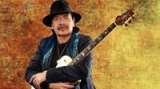 Carlos Santana passes out onstage in Michigan