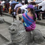 Independence Square History ignored: A woman sits on a statue at a public event Pix by M A Pushpa Kumara