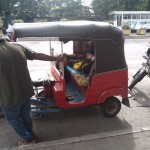 Maligawatte- Three-wheeled life: A child naps while his father is in the petrol queue Pic by Raskin Mohamed Munaf  Camera: Samsung SM-M115F