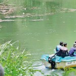 Navy and villagers searching for the body