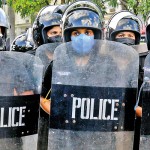 Olcott Road Kinder tactics: Women Police officers in riot gear stand by Pic by Eshan Fernando