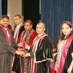 Mr. Sanjaya Bandara presenting the  scroll to a new Associate member  of CA Sri Lanka.