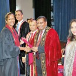 Mr. Asoka Pieris presenting the scroll to  a new Fellow member of CA Sri Lanka.