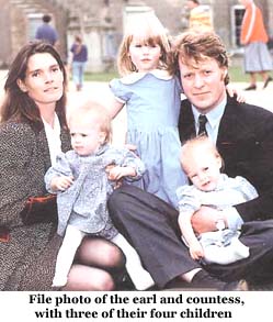 File photo of the earl and countess, with three of their four children.
