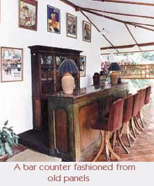 A bar counter fashioned from old panels.