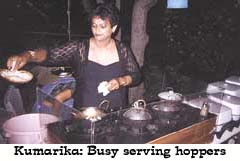 Kumarika busy serving hoppers
