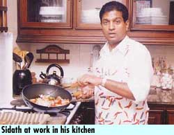Sidath at work in his kitchen