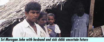 Sri Murugan John with husband and sick child