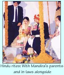 Hindu rites: With Mandira's parents and in-laws alongside