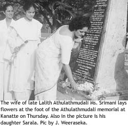 The wife of late Lalith Athulathmudali Ms Srimani lays flowers at the