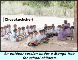 An outdoor session under a Mango tree for school children.