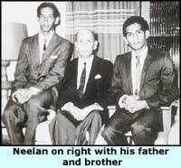 Neelan on right with his father and brother