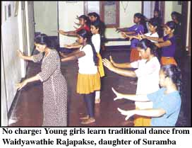 No charge: YOung girls learn traditional dance from Waidyawathie Rajapakse, daughter of Suramba