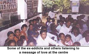 Some of the ex-addicts and others listening to a message of love at the centre