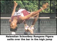 Nalandian Schoolboy Rangana Pigera sailis over the bar in the high jump.