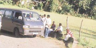 A VIP's supporters in a vehicle marked 'Anuruddha XI' at a polling booth at Polgolla