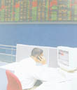 An official works at his desk as the electronic trading board of the Colombo Stock Exchange comes alive after the public gallery was open. (pic. by Ranjith Perera)