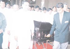 Gamini Atukorale making his final exit from parliament surrounded by Parliamentarians. Pic by Ranjith Perera