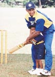 Batting for these youngsters: Lankan skipper Sanath Jayasuriya with little Chamara Dilujaya.