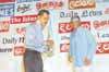 The Sunday Times Deputy Editor Anthony David accepting the B.A. Siriwardene Award on behalf of Consultant Editor Iqbal Athas from Sunil Ariyaratne