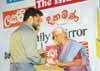 Aruna Wickremarachchi of The Sunday Times receiving the Best Designed Newspaper of the Year Award from Hema Gunawardena, one of the judges