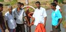 Villagers gather at the Kallaru Anicut to watch the water flowing after the Mavil Aru anicut was opened. Pic by A.T.M. Gunananda