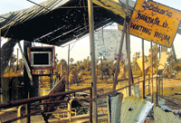 Hundreds of people carrying plastic cans standing in queues at Jaffna filling stations.Our picture of Muhamalai yesterday shows the shattered remains of what used to be the waiting room at the checkpoint