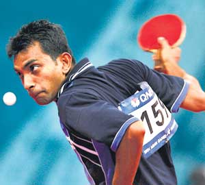 Sri Lankan table tennis player Thilina Piyadasa competes against Yemani Wael Al Qershi in the Men's Singles round of 64 match at the Al-Arabi Sports Club- AFP