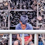 Panchikawatte  Spare parts: A vendor waits for customers.